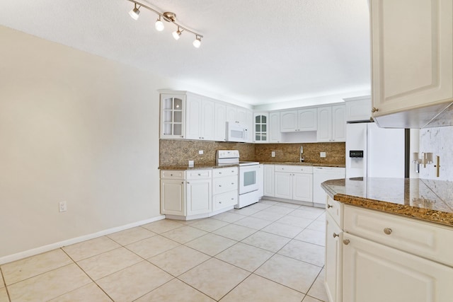 707 7th Ter, Palm Beach Gardens, FL 33418 - kitchen featuring white appliances, backsplash, glass insert cabinets, and light tile patterned floors
