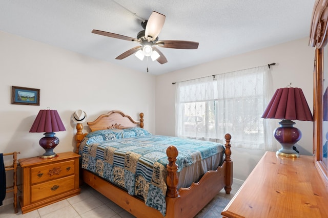 2050 NE 39th St Unit 110S, Lighthouse Point, FL 33064 - bedroom with ceiling fan and tile patterned floors