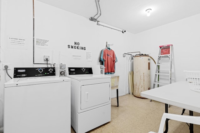 2050 NE 39th St Unit 110S, Lighthouse Point, FL 33064 - shared laundry room featuring washer and clothes dryer and light flooring