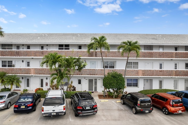 2050 NE 39th St Unit 110S, Lighthouse Point, FL 33064 - view of building exterior featuring uncovered parking