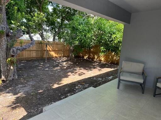 723 20th St, West Palm Beach, FL 33407 - fenced backyard with a patio