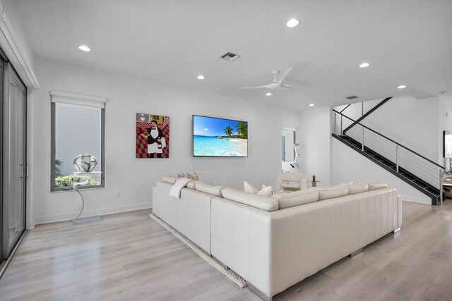 13444 Bernoulli Way, Palm Beach Gardens, FL 33418 - living area with recessed lighting, light wood finished floors, a ceiling fan, baseboards, and stairs