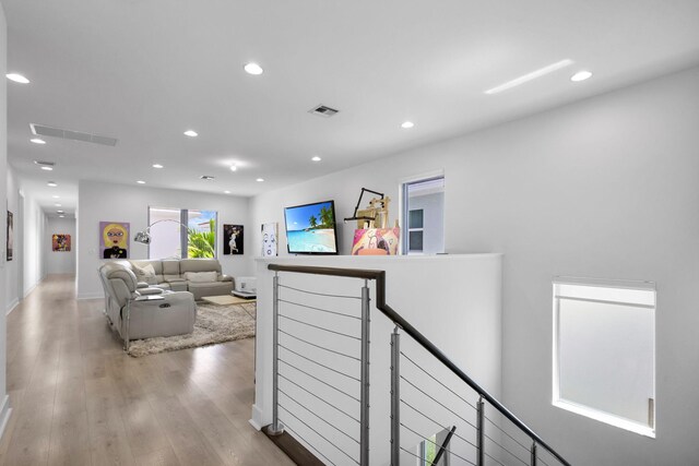 13444 Bernoulli Way, Palm Beach Gardens, FL 33418 - hallway featuring an upstairs landing, light wood-type flooring, and recessed lighting