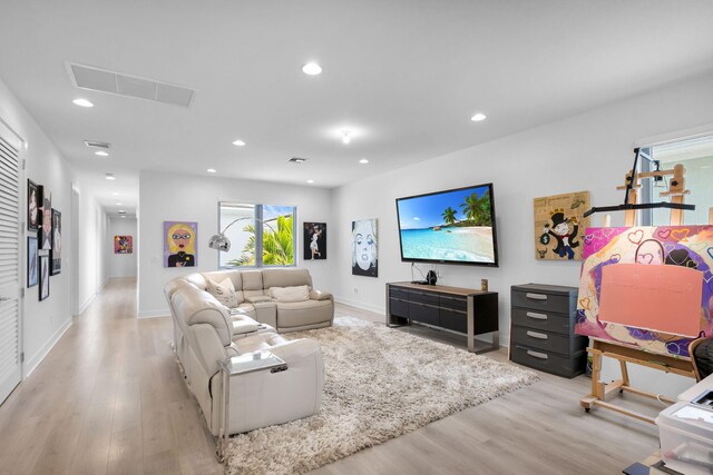 13444 Bernoulli Way, Palm Beach Gardens, FL 33418 - living room featuring light wood-style flooring, recessed lighting, and baseboards