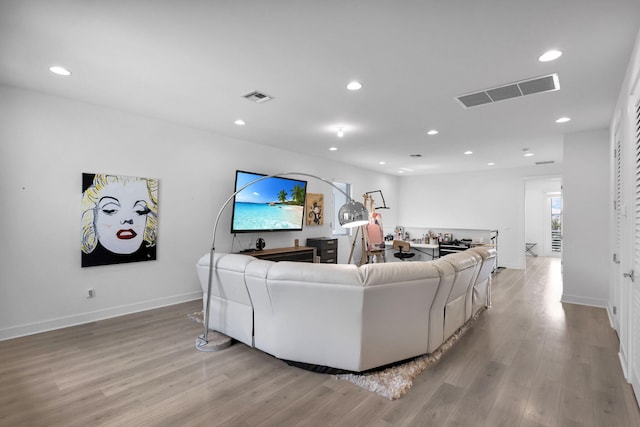 13444 Bernoulli Way, Palm Beach Gardens, FL 33418 - living room with recessed lighting, light wood finished floors, and baseboards