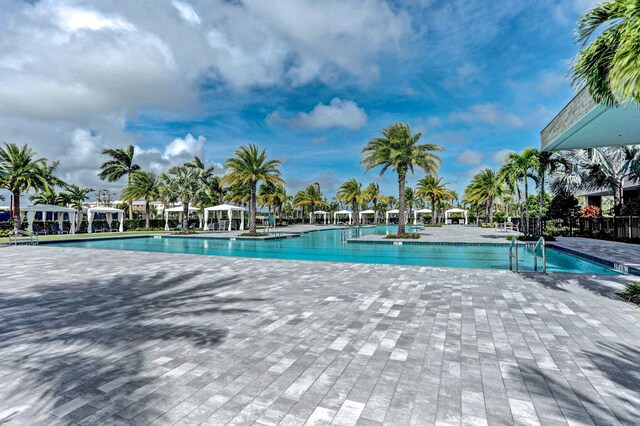 13444 Bernoulli Way, Palm Beach Gardens, FL 33418 - community pool featuring a patio