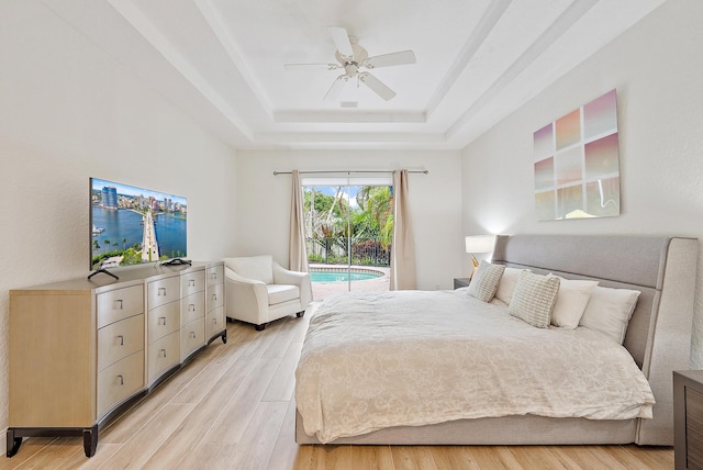 8405 Legend Club Dr, West Palm Beach, FL 33412 - bedroom with a raised ceiling, access to exterior, light wood finished floors, and a ceiling fan
