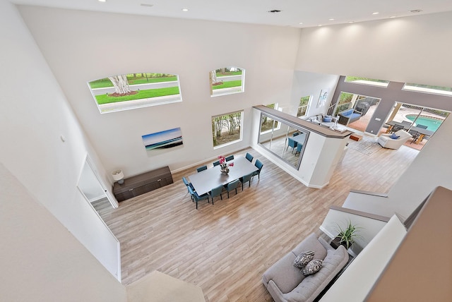 8405 Legend Club Dr, West Palm Beach, FL 33412 - living room with a towering ceiling, wood finished floors, and recessed lighting