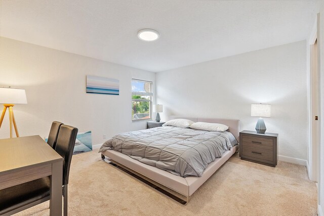 8405 Legend Club Dr, West Palm Beach, FL 33412 - bedroom featuring light carpet and baseboards