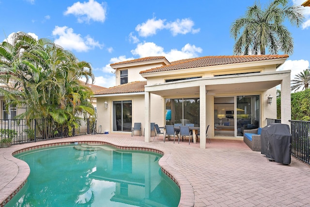 8405 Legend Club Dr, West Palm Beach, FL 33412 - rear view of house featuring stucco siding, a patio, a tile roof, and outdoor dining area