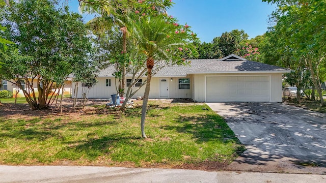 5450 Garfield Rd, Delray Beach, FL 33484 - ranch-style home featuring an attached garage, driveway, roof with shingles, and a front lawn