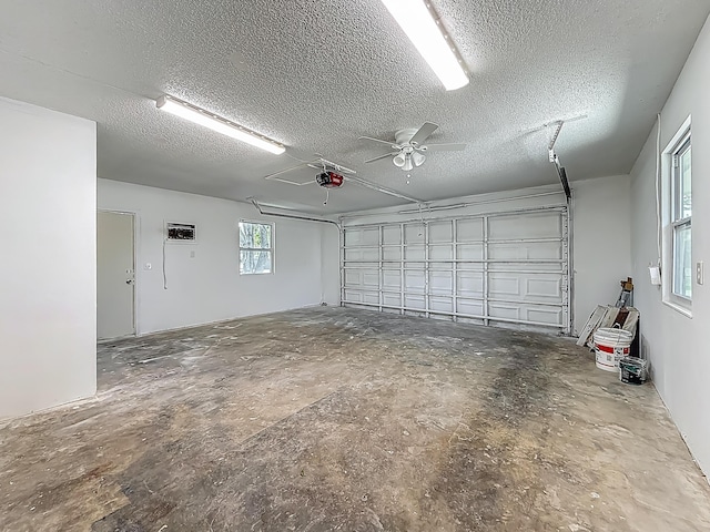 5450 Garfield Rd, Delray Beach, FL 33484 - garage with a garage door opener and ceiling fan