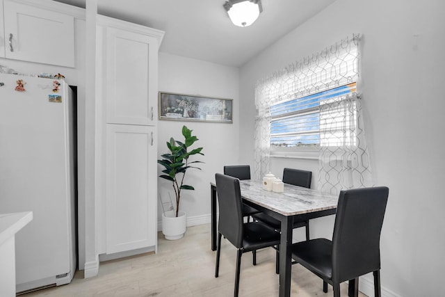 23247 Barwood Ln Unit 305, Boca Raton, FL 33428 - dining area with baseboards and light wood finished floors