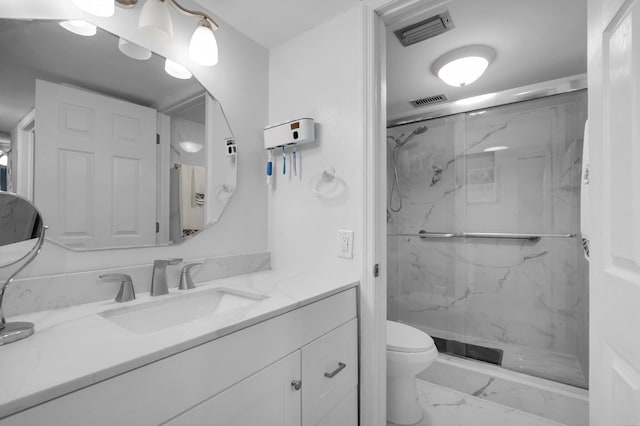 23247 Barwood Ln Unit 305, Boca Raton, FL 33428 - bathroom with marble look tiles, vanity, a marble finish shower, and toilet