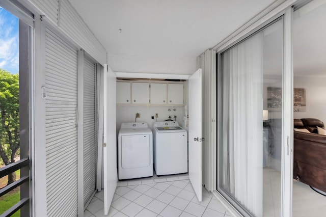 23247 Barwood Ln Unit 305, Boca Raton, FL 33428 - laundry room featuring cabinet space, washing machine and clothes dryer, and light tile patterned floors