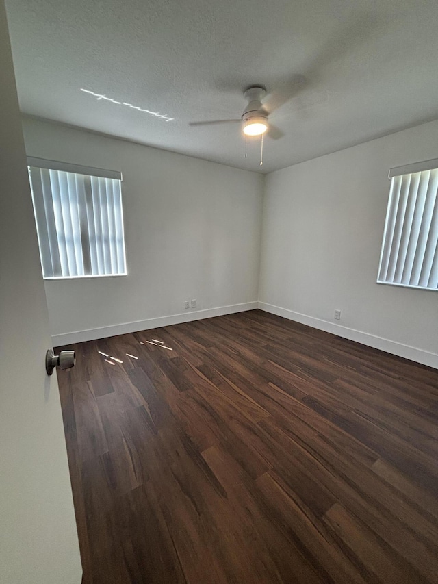 7690 Tahiti Ln Unit 102, Lake Worth, FL 33467 - unfurnished room featuring wood finished floors, a ceiling fan, and baseboards