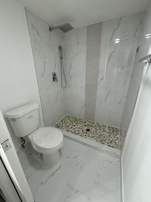 7690 Tahiti Ln Unit 102, Lake Worth, FL 33467 - full bathroom featuring marble finish flooring, toilet, and a stall shower