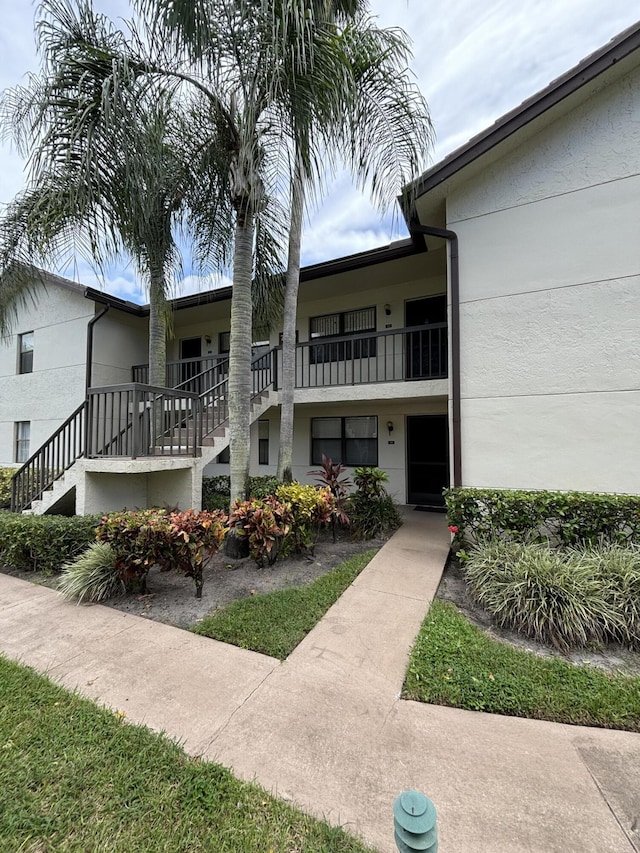 7690 Tahiti Ln Unit 102, Lake Worth, FL 33467 - view of building exterior with stairs