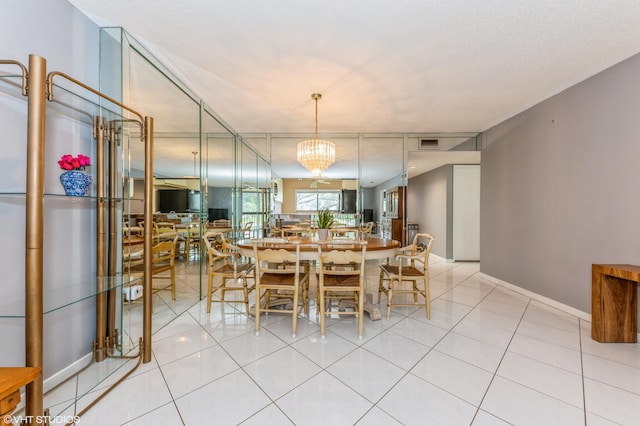 15324 Lakes Of Delray Blvd Unit 210, Delray Beach, FL 33484 - dining room with light tile patterned floors and a chandelier