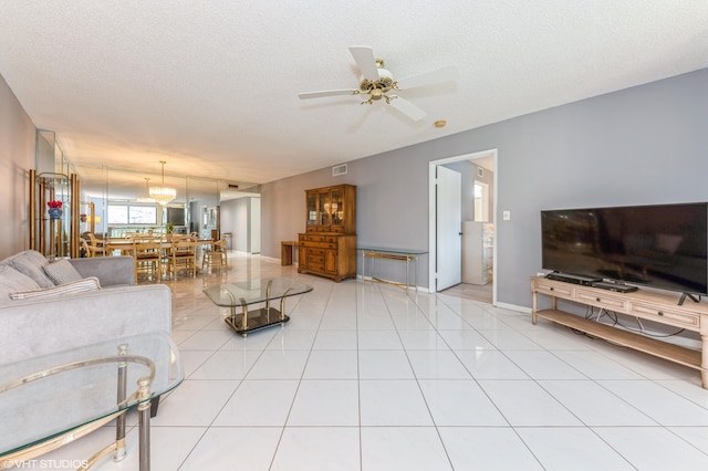 15324 Lakes Of Delray Blvd Unit 210, Delray Beach, FL 33484 - living area with ceiling fan, a textured ceiling, and light tile patterned flooring