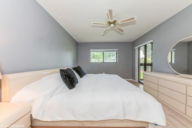 15324 Lakes Of Delray Blvd Unit 210, Delray Beach, FL 33484 - bedroom with light wood finished floors, access to outside, and a ceiling fan