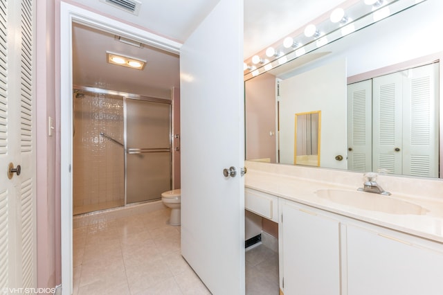 15324 Lakes Of Delray Blvd Unit 210, Delray Beach, FL 33484 - full bathroom featuring a closet, vanity, a stall shower, and tile patterned floors