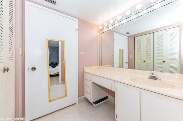 15324 Lakes Of Delray Blvd Unit 210, Delray Beach, FL 33484 - bathroom with a closet, vanity, tile patterned floors, and ensuite bathroom