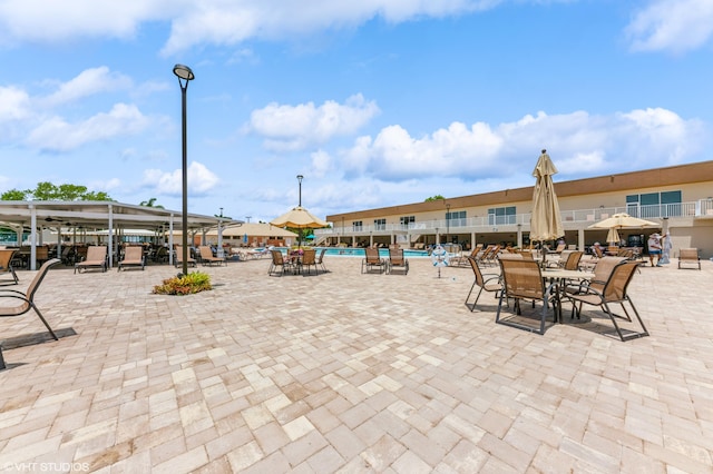 15324 Lakes Of Delray Blvd Unit 210, Delray Beach, FL 33484 - view of property's community featuring a swimming pool, outdoor dining area, and a patio area