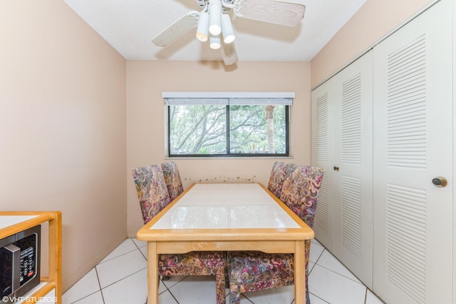 15324 Lakes Of Delray Blvd Unit 210, Delray Beach, FL 33484 - dining area with light tile patterned floors and a ceiling fan