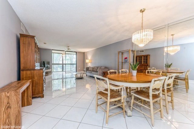 15324 Lakes Of Delray Blvd Unit 210, Delray Beach, FL 33484 - dining area with a chandelier, ceiling fan, light tile patterned floors, and expansive windows