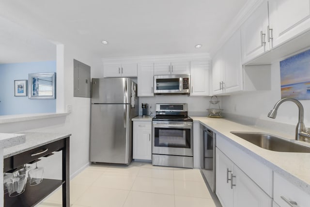 735 Monaco P, Delray Beach, FL 33446 - kitchen featuring stainless steel appliances, a sink, white cabinetry, light tile patterned floors, and recessed lighting