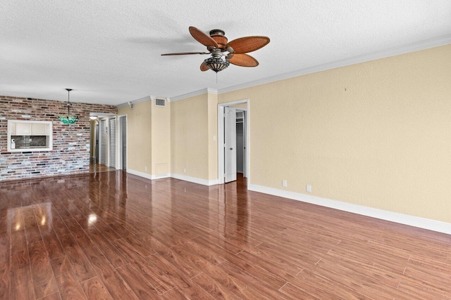 1040 Banyan Rd Unit 501C, Boca Raton, FL 33432 - unfurnished living room with a ceiling fan, a textured ceiling, wood finished floors, ornamental molding, and baseboards