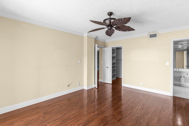 1040 Banyan Rd Unit 501C, Boca Raton, FL 33432 - spare room featuring ceiling fan, wood finished floors, a textured ceiling, ornamental molding, and baseboards