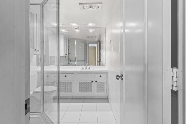 1040 Banyan Rd Unit 501C, Boca Raton, FL 33432 - bathroom with tile patterned flooring, vanity, toilet, and a shower stall