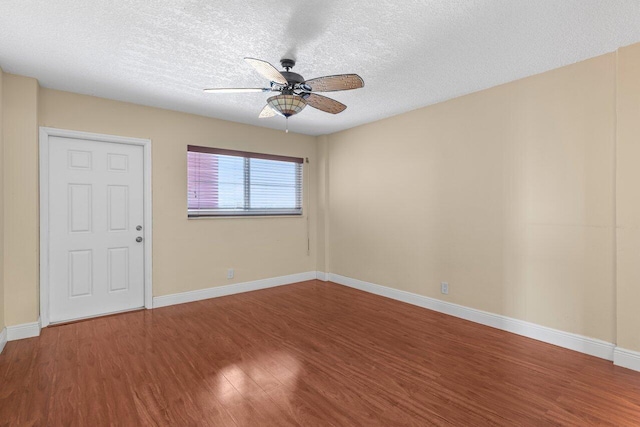 1040 Banyan Rd Unit 501C, Boca Raton, FL 33432 - spare room with wood finished floors, ceiling fan, a textured ceiling, and baseboards