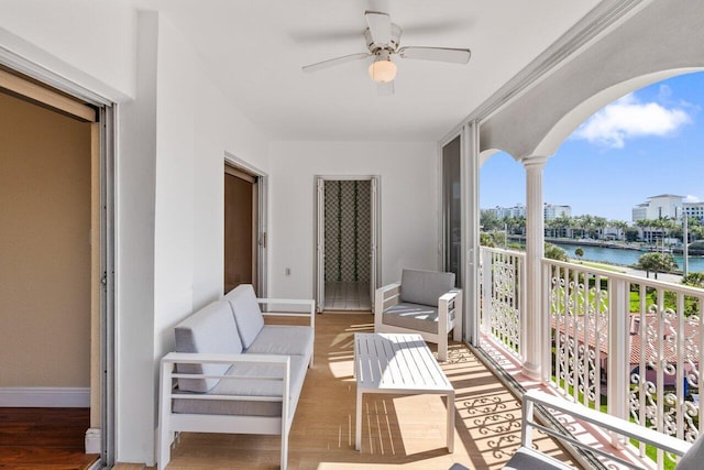 1040 Banyan Rd Unit 501C, Boca Raton, FL 33432 - balcony featuring a water view, a ceiling fan, and an outdoor living space