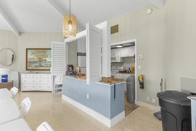 1040 Banyan Rd Unit 501C, Boca Raton, FL 33432 - kitchen with white appliances, baseboards, and pendant lighting