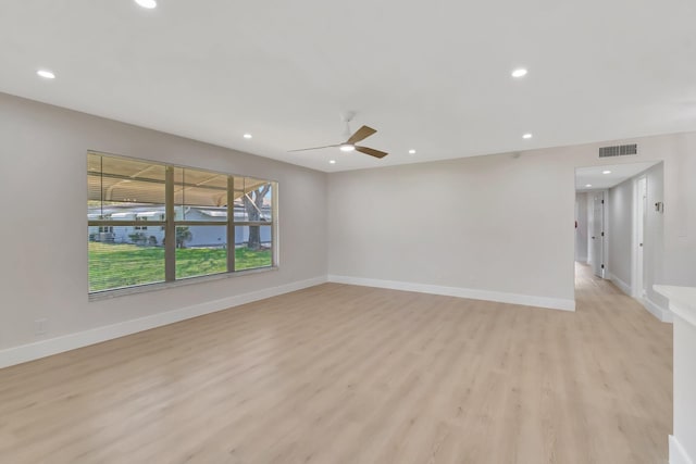 unfurnished room featuring light wood finished floors, a ceiling fan, recessed lighting, and baseboards