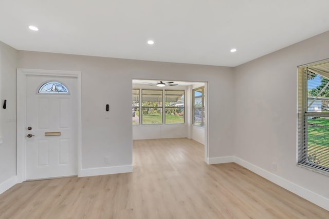 foyer entrance featuring light wood-style flooring, baseboards, ceiling fan, and recessed lighting