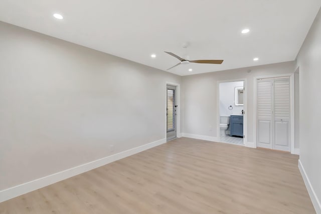 unfurnished living room with light wood finished floors, a ceiling fan, baseboards, and recessed lighting