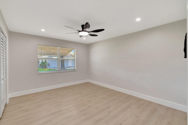 empty room featuring light wood finished floors, baseboards, ceiling fan, and recessed lighting