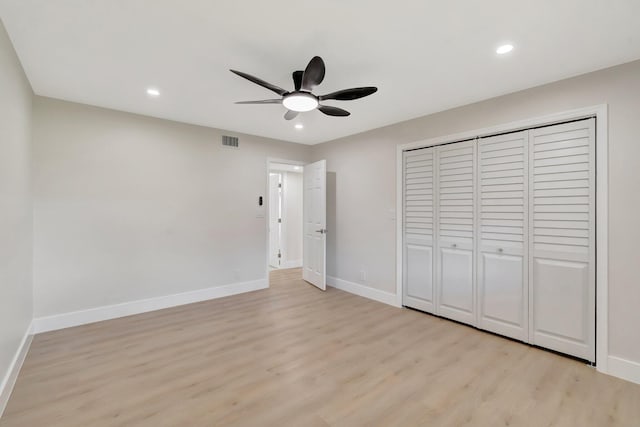 unfurnished bedroom featuring light wood finished floors, baseboards, recessed lighting, a closet, and ceiling fan
