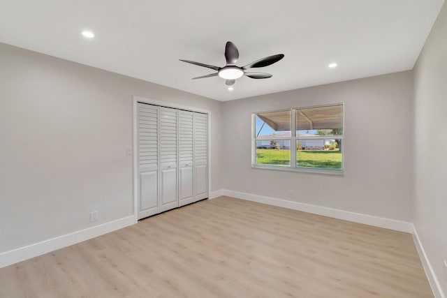 unfurnished bedroom with light wood-style floors, baseboards, a closet, recessed lighting, and a ceiling fan