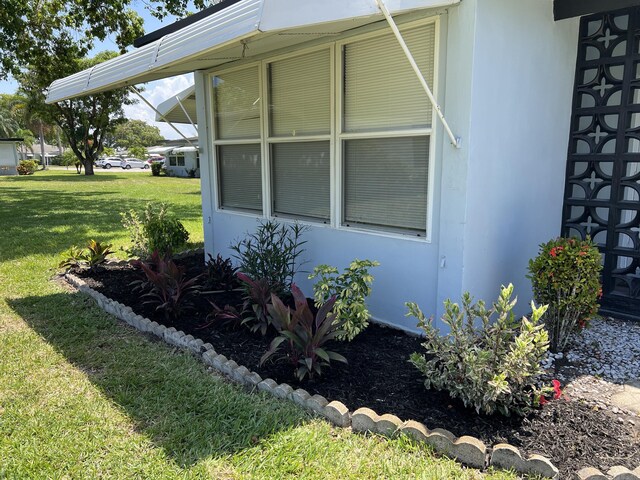 470 High Point Dr Unit A, Delray Beach, FL 33445 - view of home's exterior with a yard