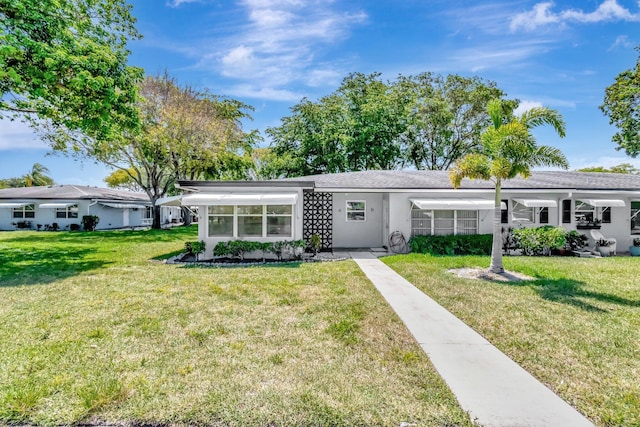 470 High Point Dr Unit A, Delray Beach, FL 33445 - ranch-style home featuring a front lawn and stucco siding