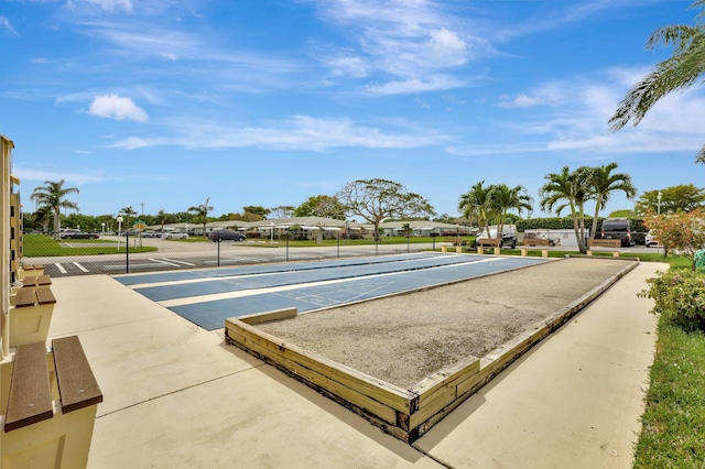 view of property's community with shuffleboard and a residential view