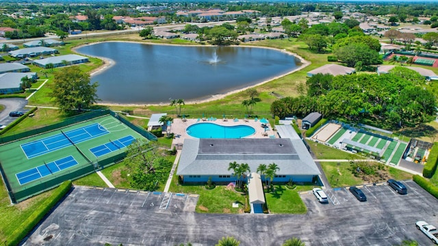 aerial view of property's location with a nearby body of water and a pool