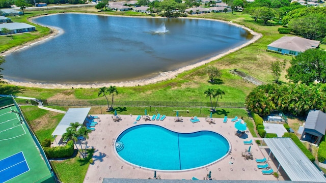 aerial view of property's location with a nearby body of water and a pool area