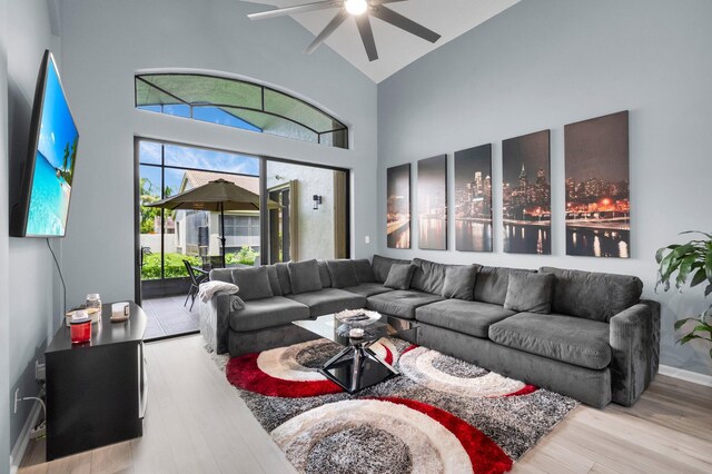 10393 Lexington Cir S, Boynton Beach, FL 33436 - living room with a ceiling fan, wood finished floors, high vaulted ceiling, and baseboards