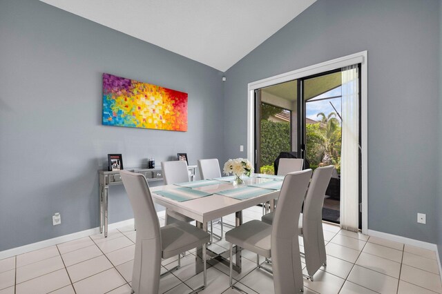 10393 Lexington Cir S, Boynton Beach, FL 33436 - dining room featuring vaulted ceiling, baseboards, and light tile patterned flooring